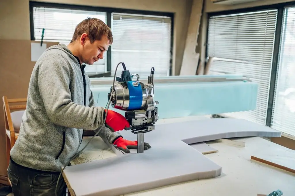 Upholstery foam and fabric cutting in a furniture workshop